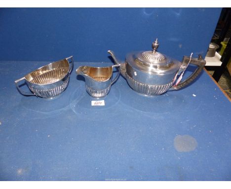 A three piece Silver Teaset including teapot, sucrier and milk jug, London 1900/01, maker Walker & Hall.   ***