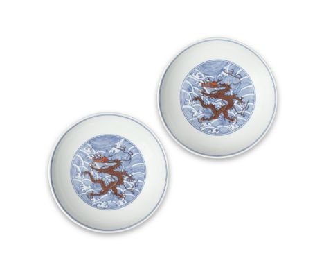 A RARE PAIR OF BLUE AND WHITE IRON-RED ENAMELLED 'DRAGON' DISHESDaoguang seal marks and of the periodEach finely potted with 