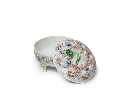 A WUCAI TRIPOD BOWL AND COVERKangxiThe cover finely moulded with lotus petal panels, surmounted by a lotus spray finial, the 