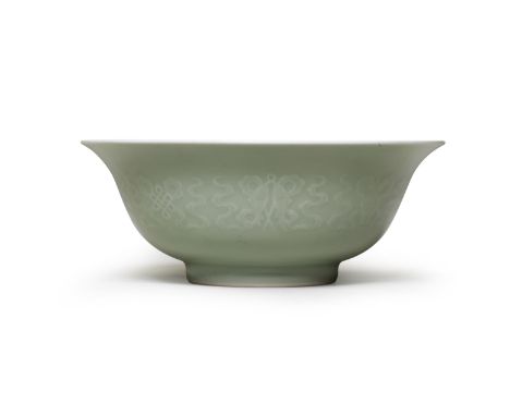 A PALE-GREEN-GLAZED RELIEF-MOULDED BOWLYongzheng six-character mark and of the periodExquisitely potted with deep rounded sid