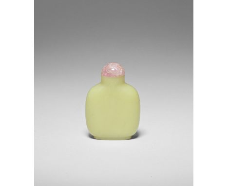 A YELLOW JADE SNUFF BOTTLE19th centuryOf rounded square form with a cylindrical neck and oval foot ring, the surface undecora