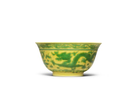A RARE YELLOW-GROUND GREEN-ENAMELLED 'DRAGON' BOWLQianlong seal mark and of the periodIncised around the exterior with two st