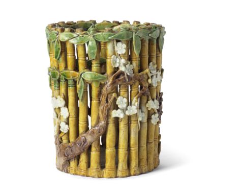 A FAMILLE VERTE BISCUIT RETICULATED 'THREE FRIENDS OF WINTER' BRUSHPOT, BITONGKangxiExquisitely moulded in the form of a bamb