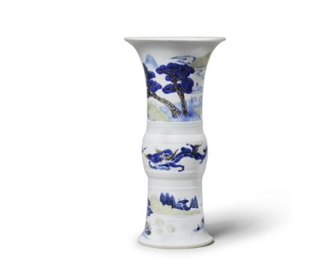 AN UNDERGLAZE-BLUE, COPPER-RED AND CELADON-GLAZED BEAKER VASE, GUXuande six-character mark, KangxiPainted around the exterior