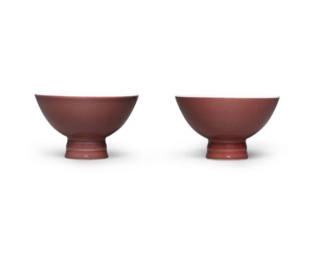 A RARE PAIR OF SANG-DE-BOEUF STEM CUPSYongzheng seal marks and of the period Each well potted with deep curving sides, raised