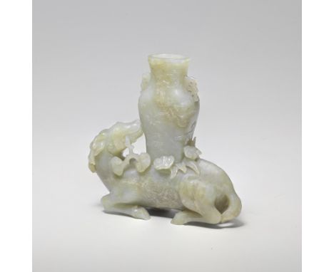 A PALE GREEN AND RUSSET JADE DEER AND VASE GROUP17th/18th centuryExquisitely carved as a recumbent deer with its head turned 