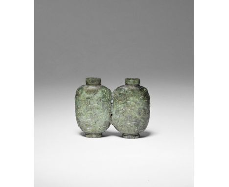 A SPINACH GREEN JADE 'DOUBLE' SNUFF BOTTLE18th/19th centuryExpertly carved in the form of two conjoined bottles, each of roun