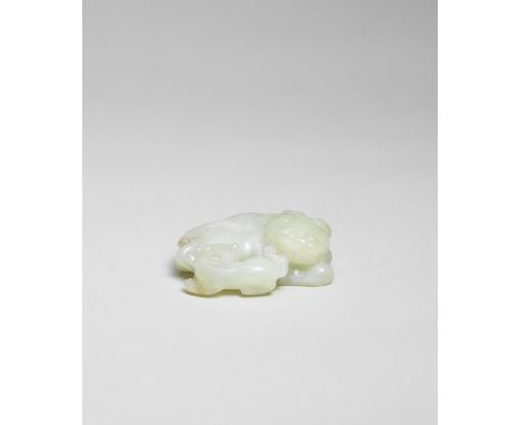 A PALE GREEN JADE CARVING OF A MYTHICAL BEAST AND CUB17th/18th centuryThe single-horned beast carved in a recumbent position,