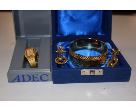 A ladies gold plated wrist watch; together with a gold plated bangle and a pair of ear-rings 