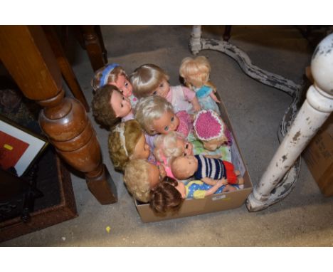 A box containing 11 vintage dolls