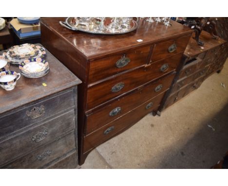 A George III mahogany chest, fitted two short over three long drawers, raised on bracket feet