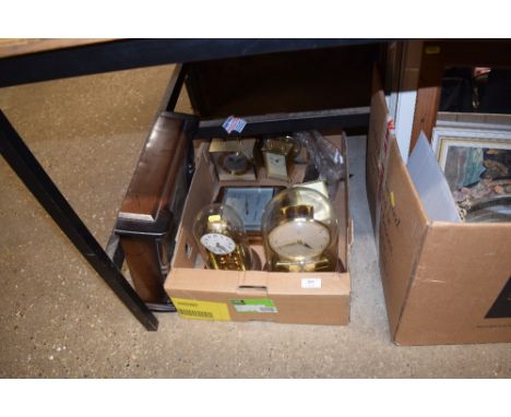 A box of various clocks and a barometer