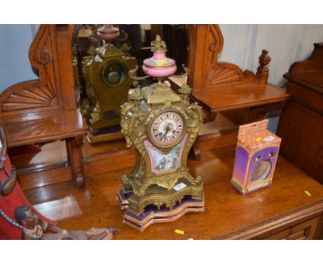 A 19th Century French gilt metal and porcelain clock, with twin train movement, (for restoration)