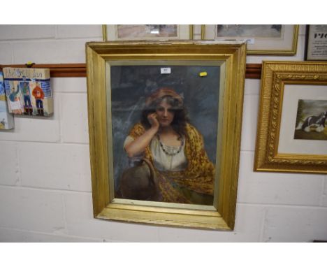 A gilt framed portrait oil depicting a gypsy girl, unsigned