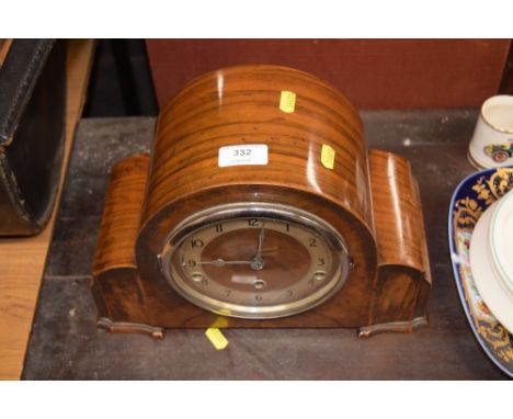 A walnut cased three hole mantel clock