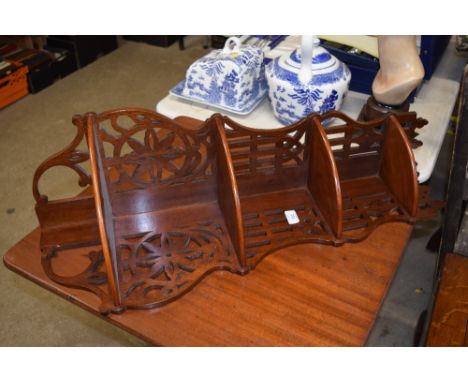 A mahogany fret carved four tier corner wall shelf