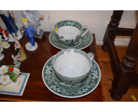 A pair of Spode oversized tea cups and saucers, decorated in the Greek manner