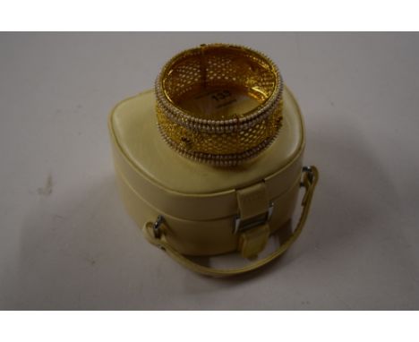 An Eastern style pearl mounted bangle
