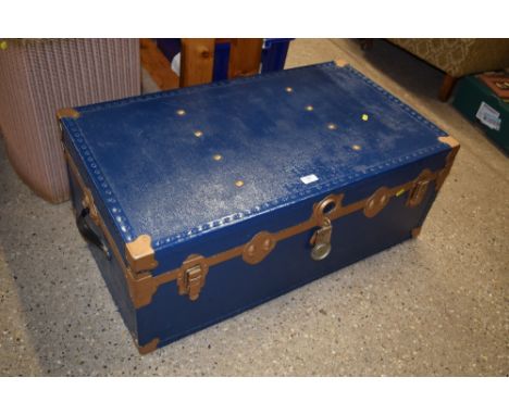 A blue painted travelling trunk