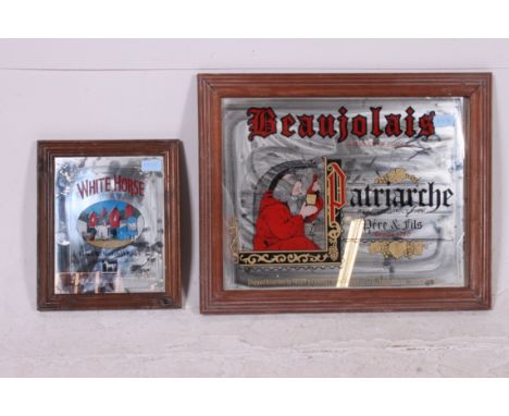 2 vintage 20th century pub advertising mirrors, one for Beaujolais, the other for White Horse Whisky. Measures: 44cm x 56cm.