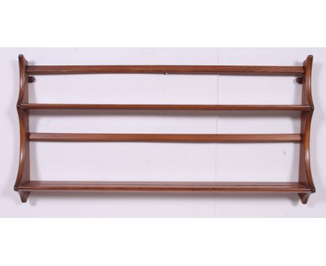 A retro 1970's Ercol beach and elm wall plate rack / plate rack being designed by Lucian Ercolani. Measures: 50cm x 97cm x 13
