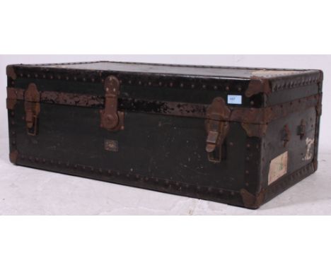 A 20th century vintage steamer trunk having hinged top and exterior metal corners together with 2 brown leather suitcases ( s