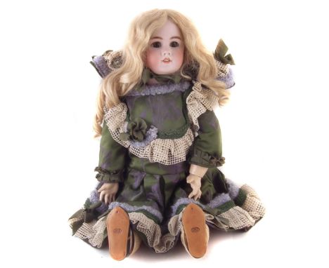 Jumeau doll, with open mouth and sleep eyes, the reverse of the head marked DEP and 11 at the base of the neck, 59cm high CON