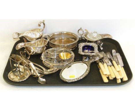 Three various plated sauce boats, wine coaster, salt cellars, silver embossed mirror, silver caddy spoon, two glass mustards 