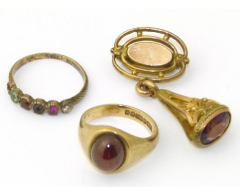 A selection of jewellery, to include 9ct gold garnet single stone ring, an amethyst fob and a vari-gem "Regard" ring. We are 