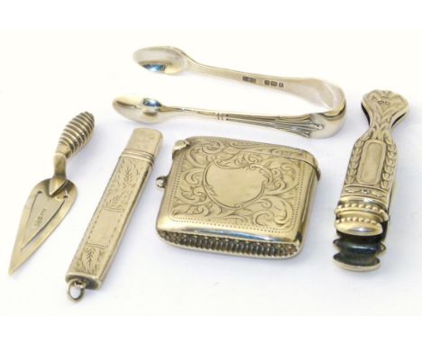 Birmingham silver trowel bookmark, vesta case, pencil case, paper clip and pair of small sugar nips. We are unable to do cond