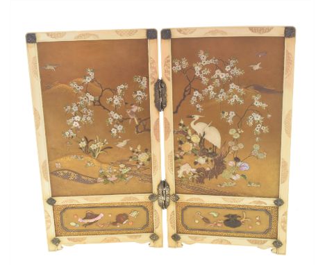 A fine Meji Period Japanese ivory shibayama folding table screen, circa 1900. The exterior lacquered in black and gold with b