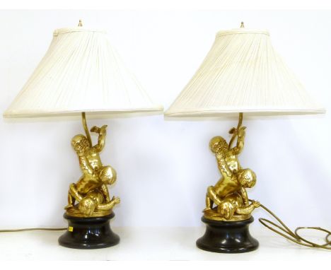 Pair of gilt cherub lamp bases and shades We are unable to do condition reports on our Interiors Sale
