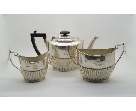 A late Victorian bachelors silver tea service, the bodies fluted, with engraved monogram, by&nbsp;Watson &amp; Gillott, Sheff