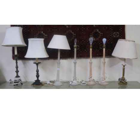 A mixed lot of three assorted cast metal base table lamps and two pairs of turned wooden table lamps (7) Condition Report:Ava