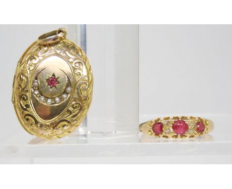 A 9ct locket with seed pearl crescent moon and ruby and a 18ct ruby and diamond set ring, weighs 4.7gms together&nbsp; Condit