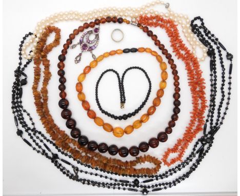 A string of faceted amber beads, weight 33.3gms, amber chip necklace weight 40.3gms, coral beads 42.2gms, black glass bead ne
