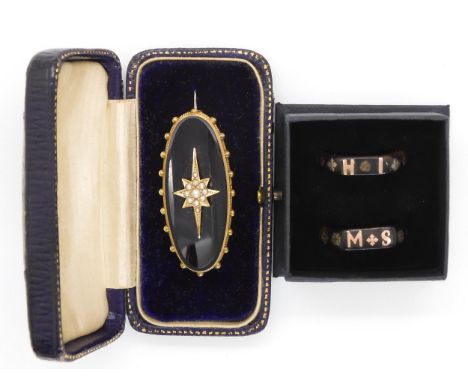 Two tortoiseshell pique wear mourning rings together with an oval onyx mourning brooch set with a seed pearl star burst in ye