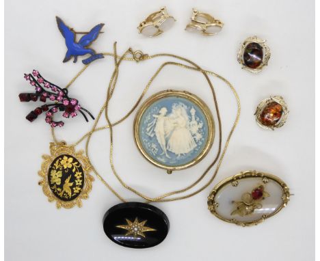 An oval onyx mourning brooch with seed pearl set star burst, an enamelled League of Pity brooch, an agate and pinchbeck brooc
