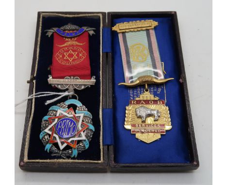 A Birmingham silver and enamel Masonic medal presented to Brother P. Sewell by Royal Albert Lodge and a Birmingham silver and