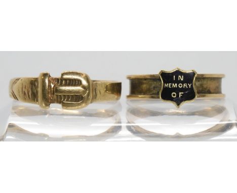 A 9ct buckle ring 2gms and a yellow metal and enamel memorial ring, 1.3gms Condition Report:Available upon request