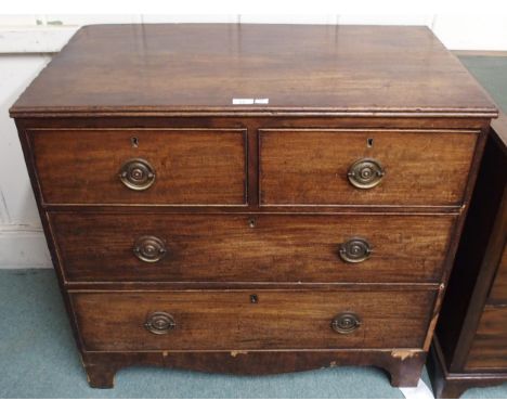A Georgian mahogany two over two chest of drawers on shaped bracket base, 83cm high x 91cm wide x 51cm deep Condition Report: