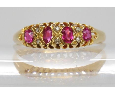 An 18ct ruby and diamond set ring, R 1/2, weight 2.8gms Condition Report:Available upon request