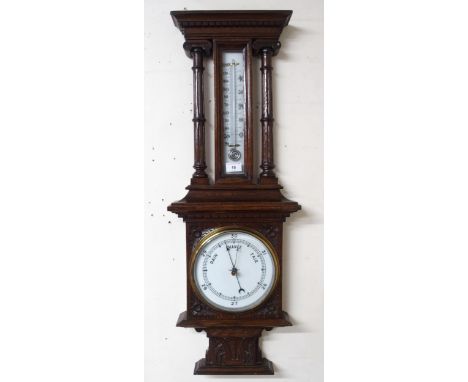 A Victorian mahogany barometer/thermometer with carved column uprights Condition Report:Available upon request