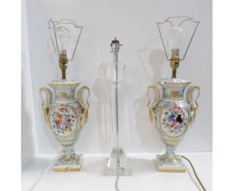 A pair of Limoges swan handled table lamps and a further glass lamp (shades available) Condition Report:one Limoges lamp smas