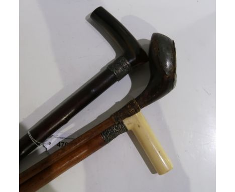 A Victorian silver mounted walking stick together with another and a William Parker Carnoustie golf club Condition Report:Ava