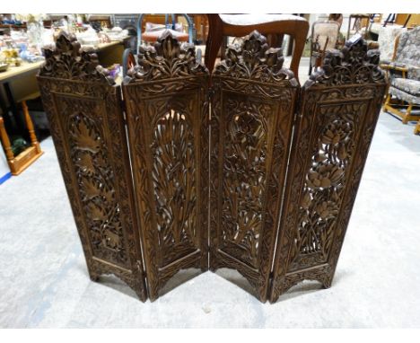     An Early 20th Century Carved Hardwood Four Panel Screen, Decorated With Flowers &amp; Rushes                             