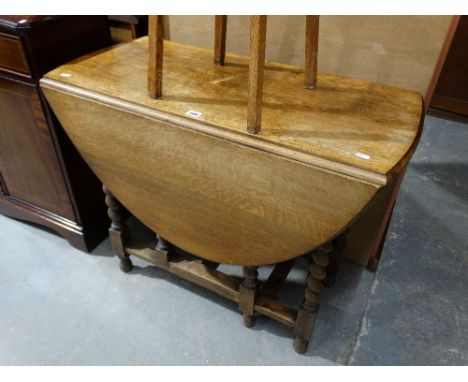     An Early 20th Century Polished Oak Gate Leg Table                               