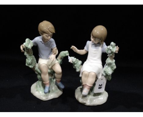     A Pair Of Nao Porcelain Child Groups                                            