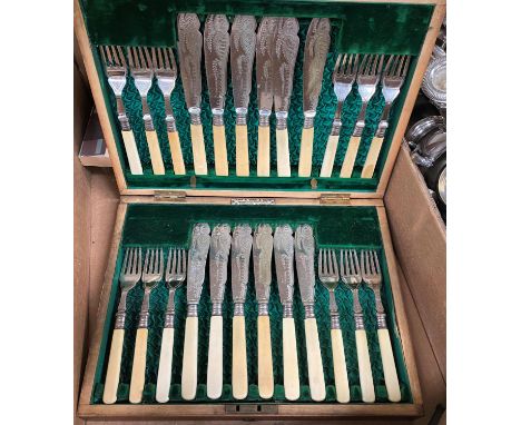A hand mirror with hallmarked silver engine turned back; a silver fruit knife; a fish canteen in walnut case; other cutlery; 