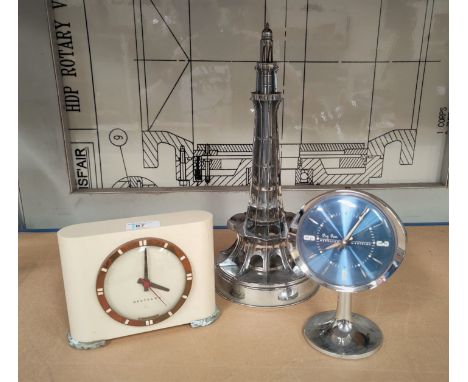 A Westclox mantel clock, a similar chrome coloured Westclox clock and a chrome lamp fitting in the form of a tower 